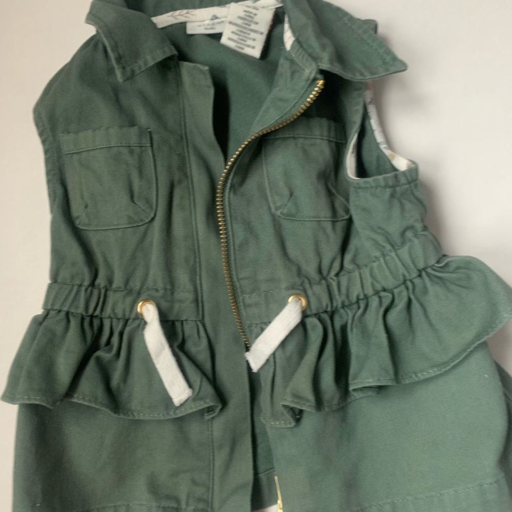 Army green Aspen Kids vest with ruffle peplum